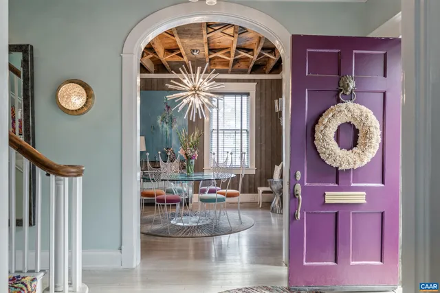 a view of entryway livingroom and hall with wooden floor