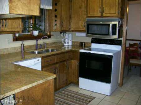 234 Farmbrook Road Mount Airy, NC 27030 - Photo 3 of 9 Other. Kitchen has new granite counter tops, new sink, new dishwasher and microwave.