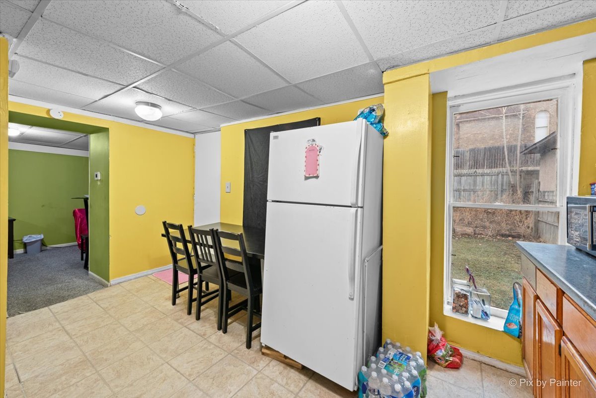 58 South Geneva Street Elgin, IL 60120 - Photo 18 of 24 a very nice looking dining room with a large window