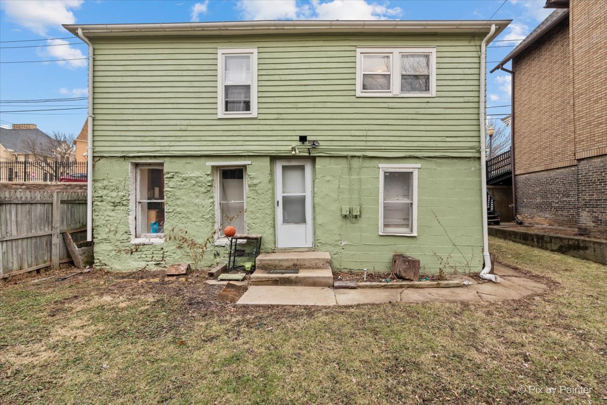 58 South Geneva Street Elgin, IL 60120 - Photo 23 of 24 a group of people sitting in front of a house