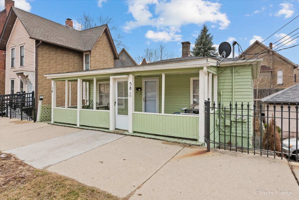 58 South Geneva Street Elgin, IL 60120 - Photo 3 of 24 a view of a house with a garden