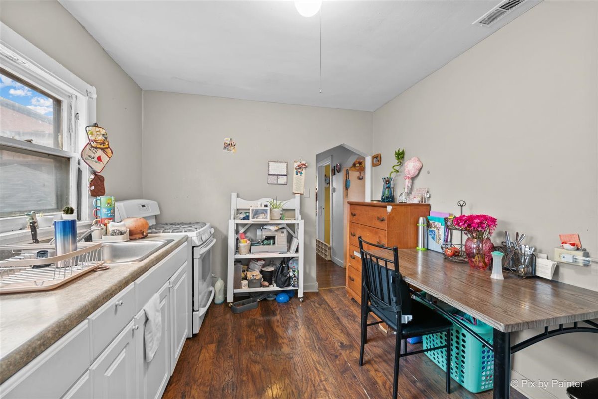 58 South Geneva Street Elgin, IL 60120 - Photo 7 of 24 a view of a kitchen with workspace and a window