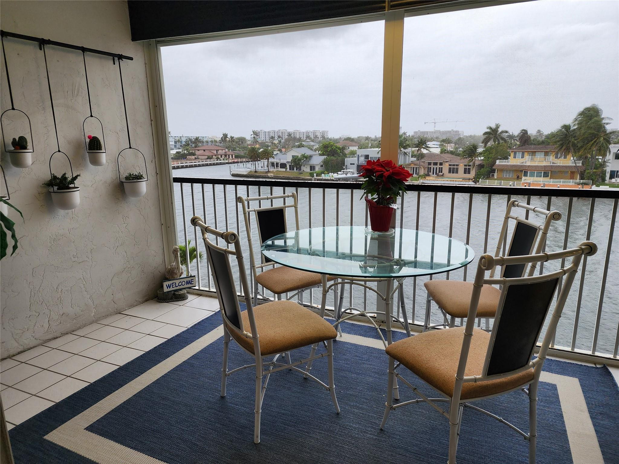 299 North Riverside Drive, Unit 406 Pompano Beach, FL 33062 - Photo 8 of 10 a view of a chairs in balcony