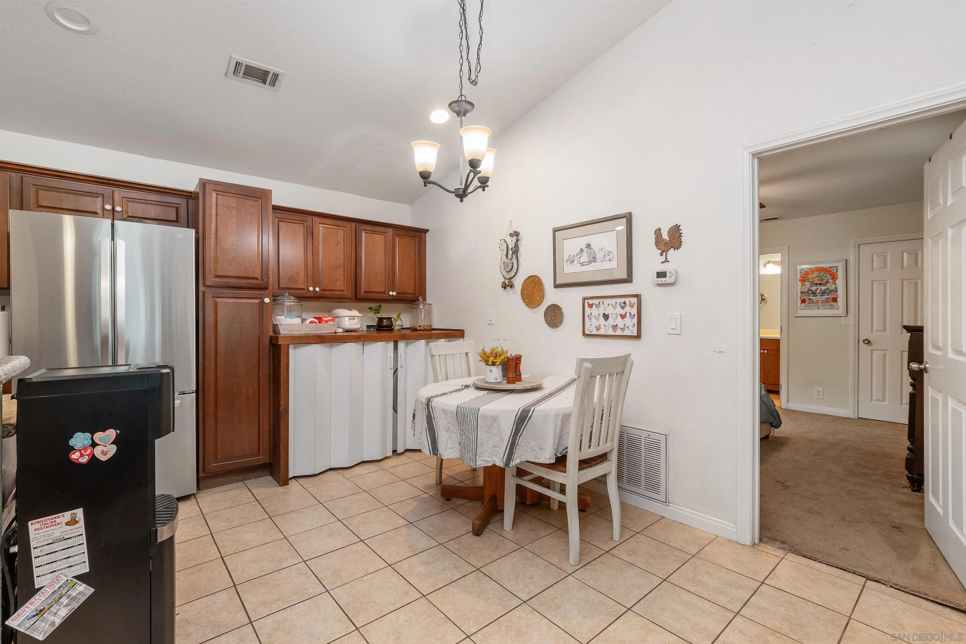 15990 El Monte Road Lakeside, CA 92040 - Photo 15 of 36 a view of kitchen with refrigerator furniture and a refrigerator