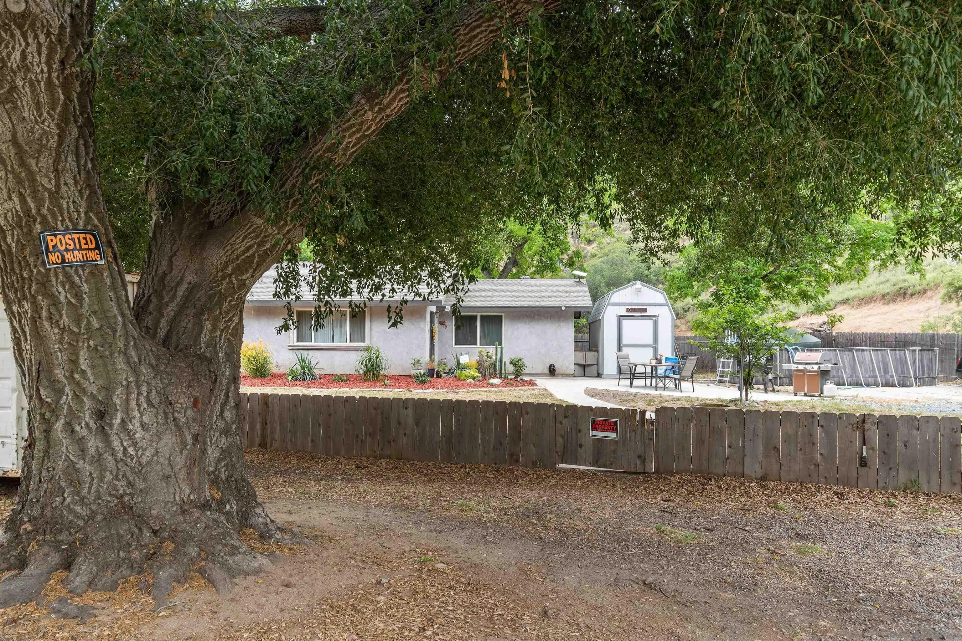 15990 El Monte Road Lakeside, CA 92040 - Photo 3 of 36 a view of backyard with a table and chairs