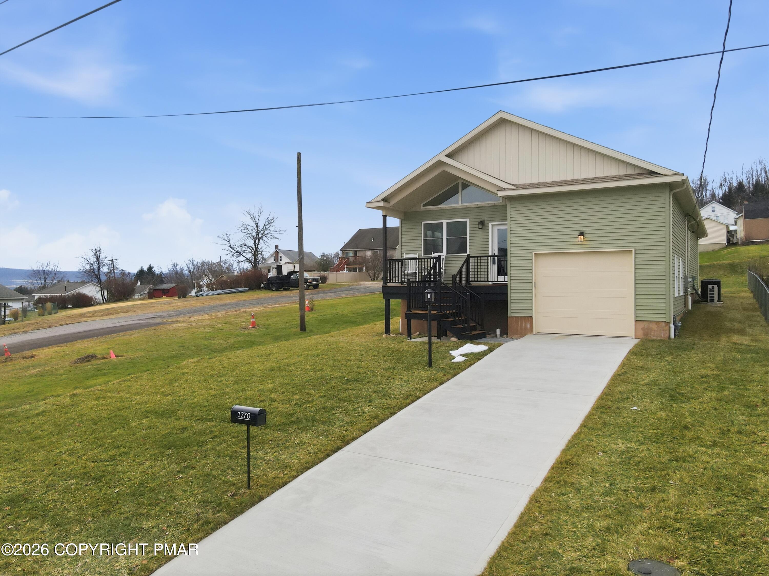 1270 Franklin Street Old Forge, PA 18518 - Photo 3 of 56 a front view of a house with a yard