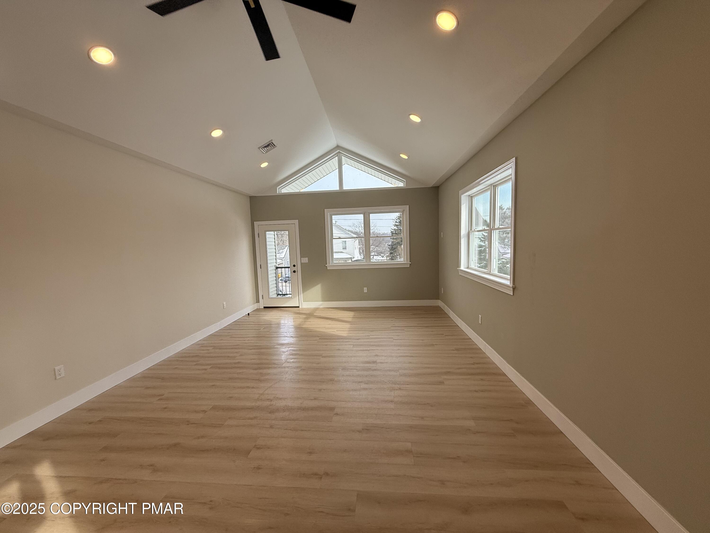 1270 Franklin Street Old Forge, PA 18518 - Photo 6 of 30 a view of empty room with wooden floor and fan
