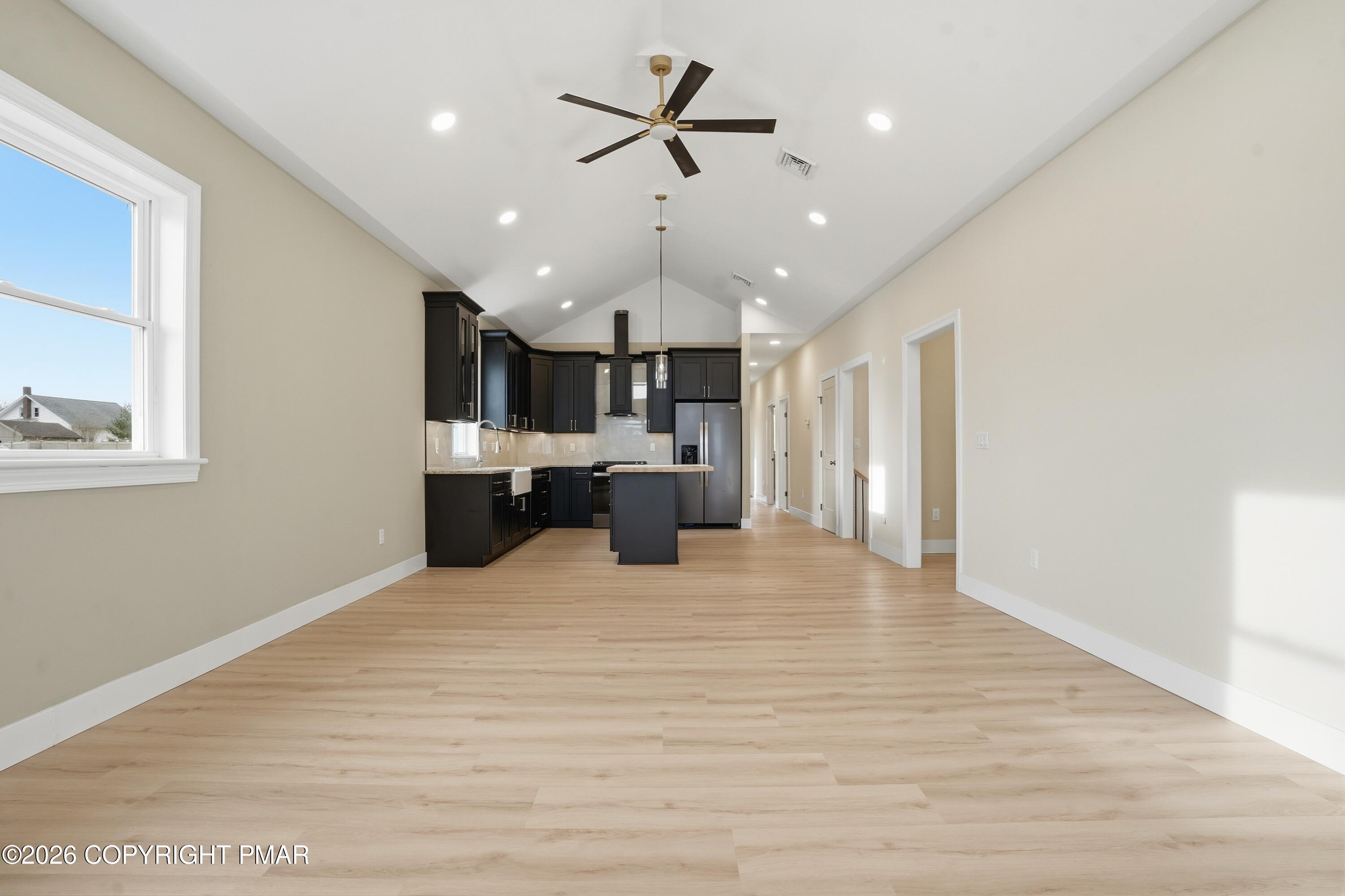 1270 Franklin Street Old Forge, PA 18518 - Photo 7 of 56 a large kitchen with cabinets and wooden floor
