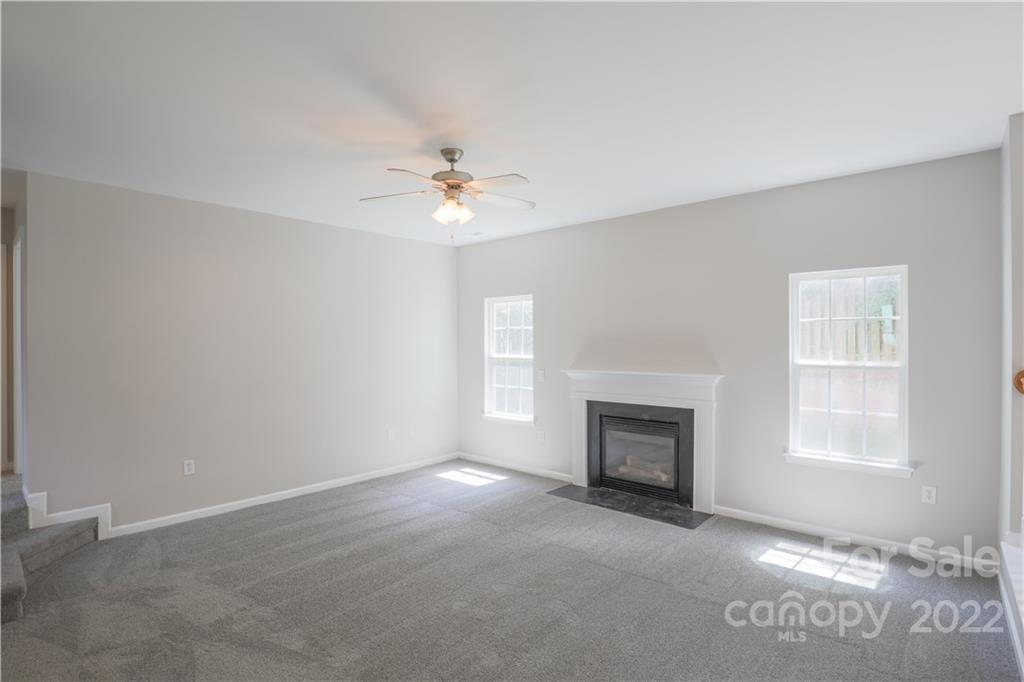 328 Wellridge Drive Fort Mill, SC 29708 - Photo 3 of 23 an empty room with windows and fireplace