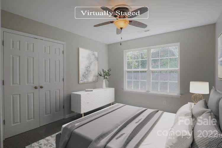 328 Wellridge Drive Fort Mill, SC 29708 - Photo 7 of 23 a bedroom with a bed and a window