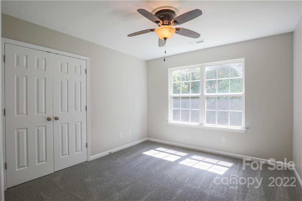 328 Wellridge Drive Fort Mill, SC 29708 - Photo 8 of 23 an empty room with a window and a fan