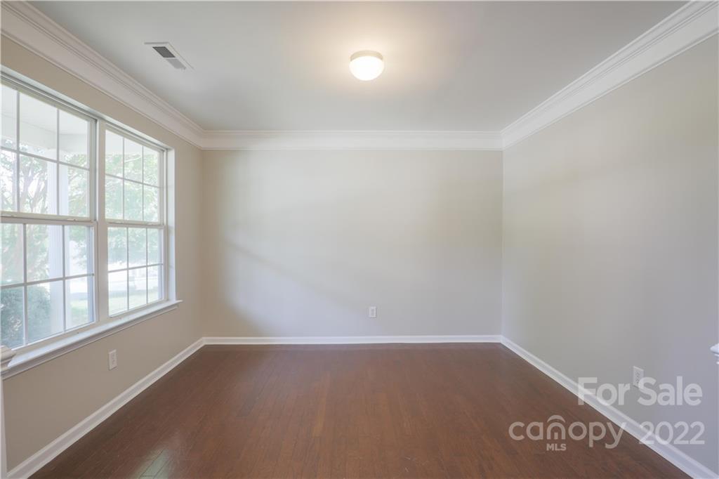 328 Wellridge Drive Fort Mill, SC 29708 - Photo 10 of 23 an empty room with wooden floor and windows