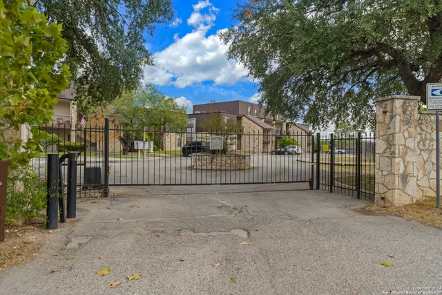 a view of a wrought iron fences in front of house