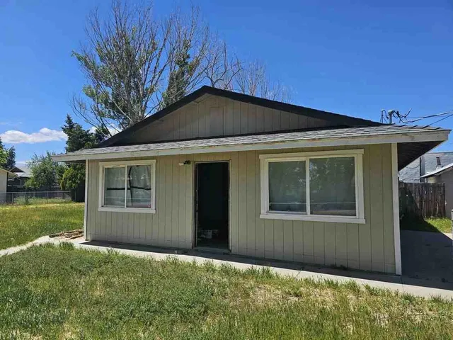 front view of a house with a garden