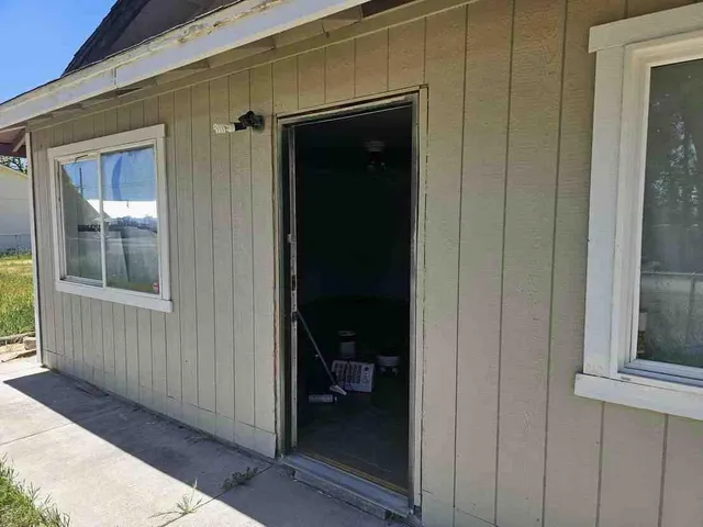 a view of a front door and a window