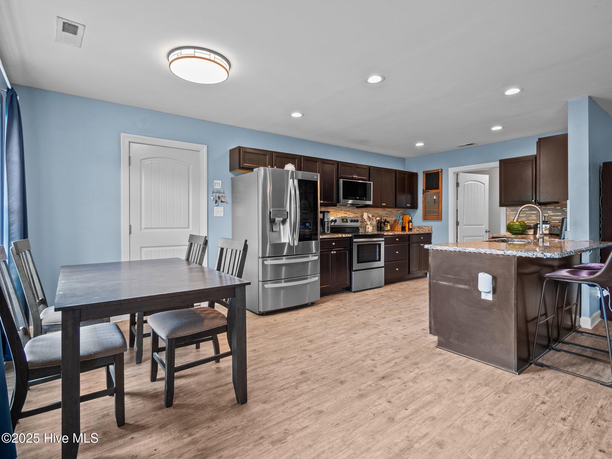660 Riggs Road Hubert, NC 28539 - Photo 9 of 36 Eating area into the kitchen