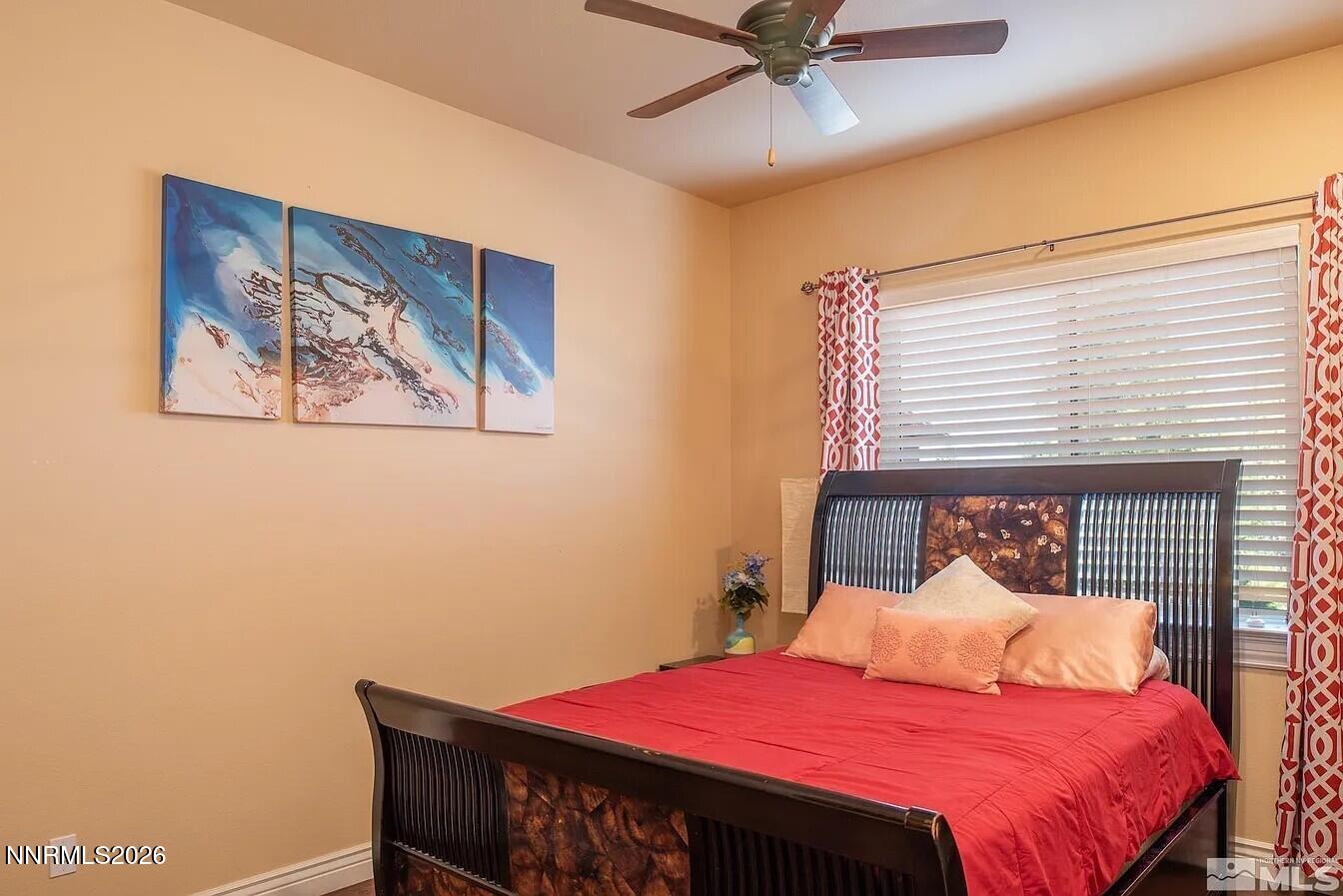 3945 Aspen Reno, NV 89511 - Photo 12 of 21 a bedroom with a bed and a chandelier
