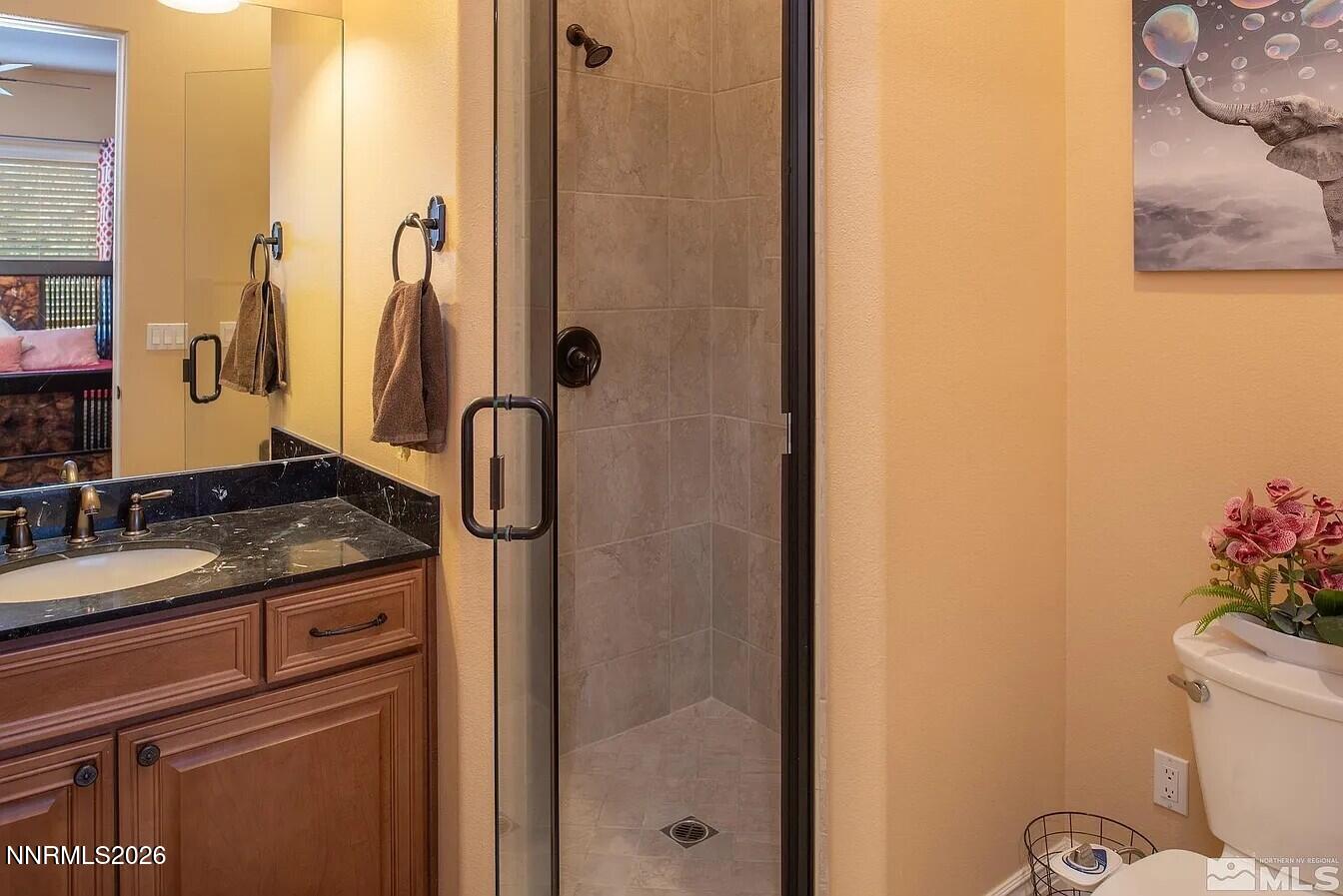 3945 Aspen Reno, NV 89511 - Photo 14 of 21 a bathroom with a granite countertop sink and a mirror