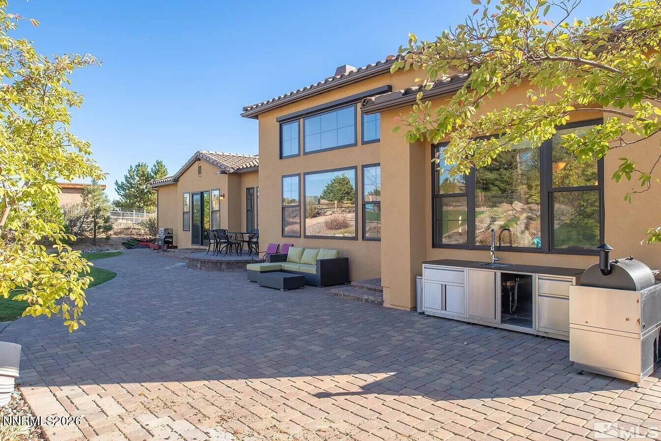 3945 Aspen Reno, NV 89511 - Photo 18 of 21 a view of a house with backyard porch and sitting area
