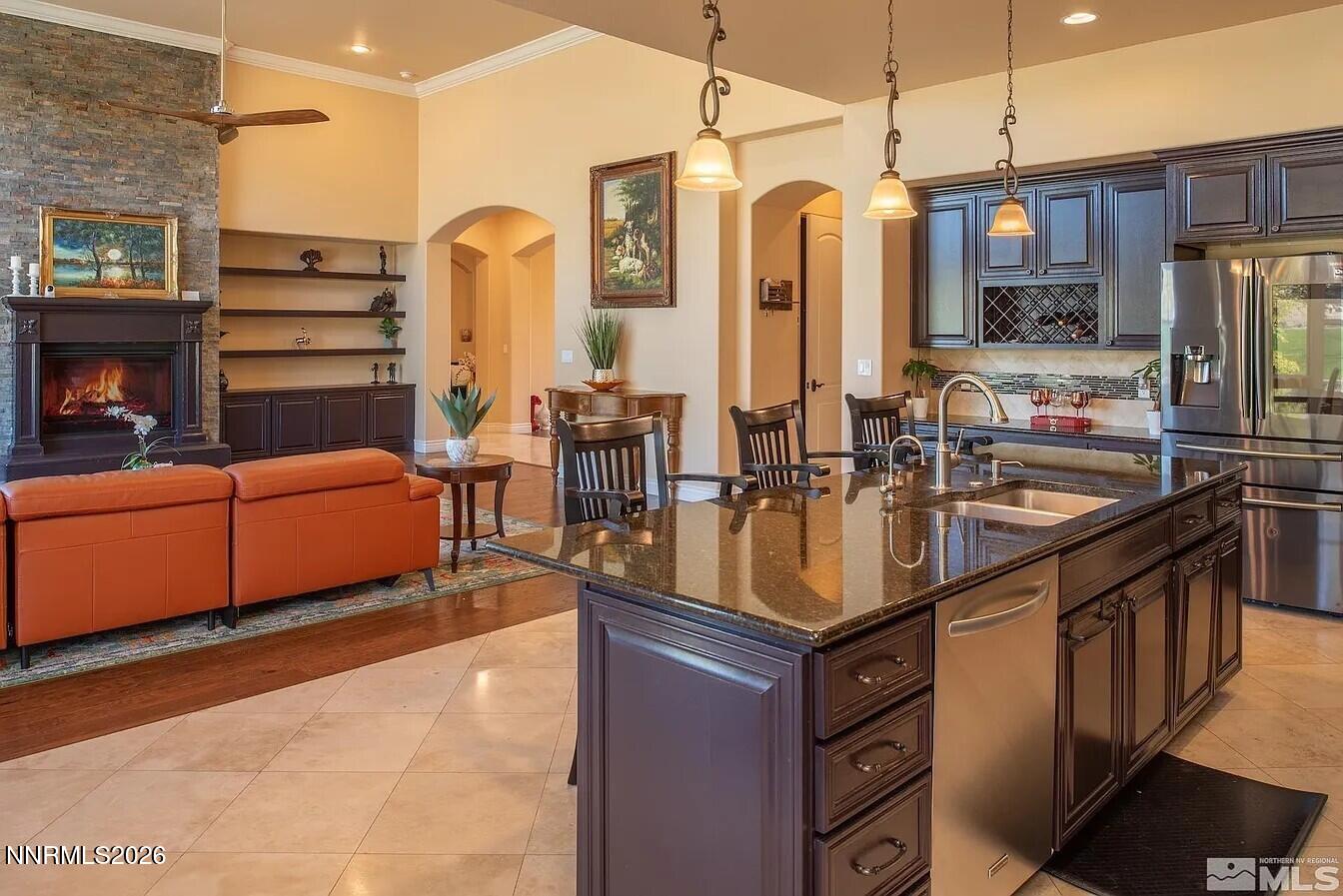 3945 Aspen Reno, NV 89511 - Photo 5 of 21 a kitchen with sink a refrigerator and cabinets