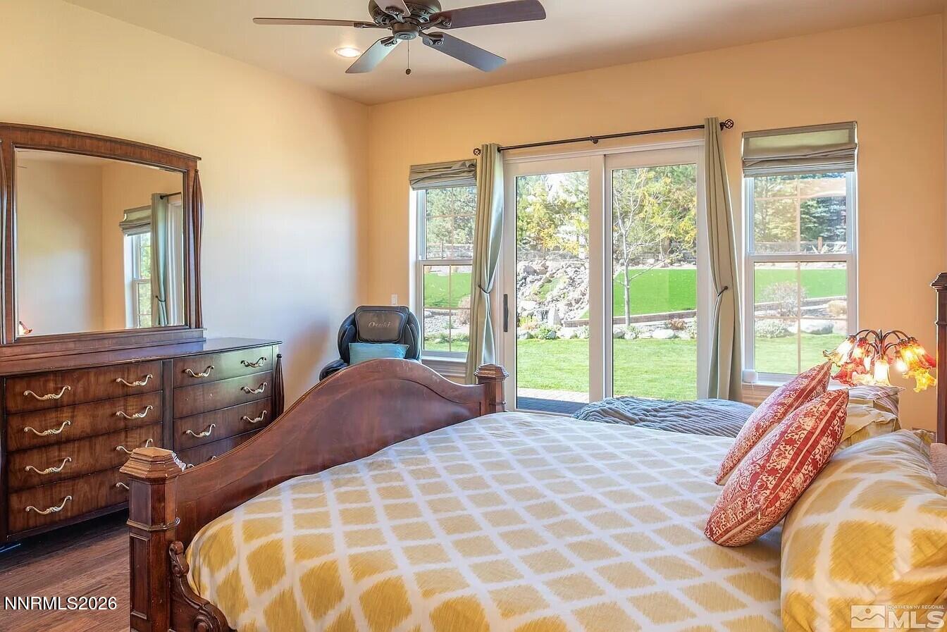 3945 Aspen Reno, NV 89511 - Photo 9 of 21 a bed sitting in a bedroom next to a window