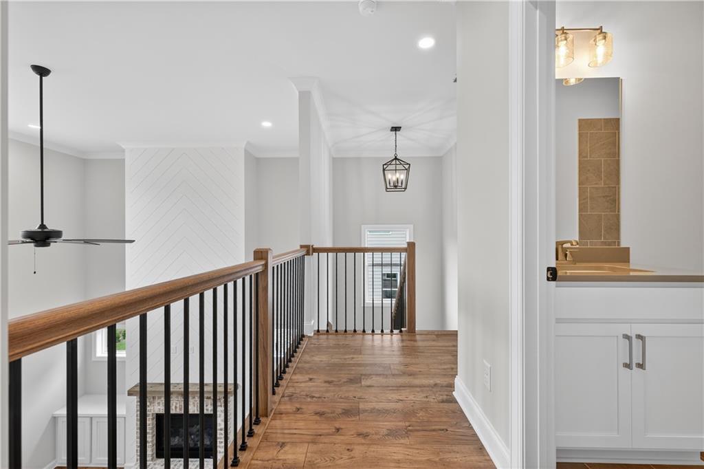 3787 Cheyenne Lane Jefferson, GA 30549 - Photo 30 of 82 a view of a hallway with wooden floor and staircase