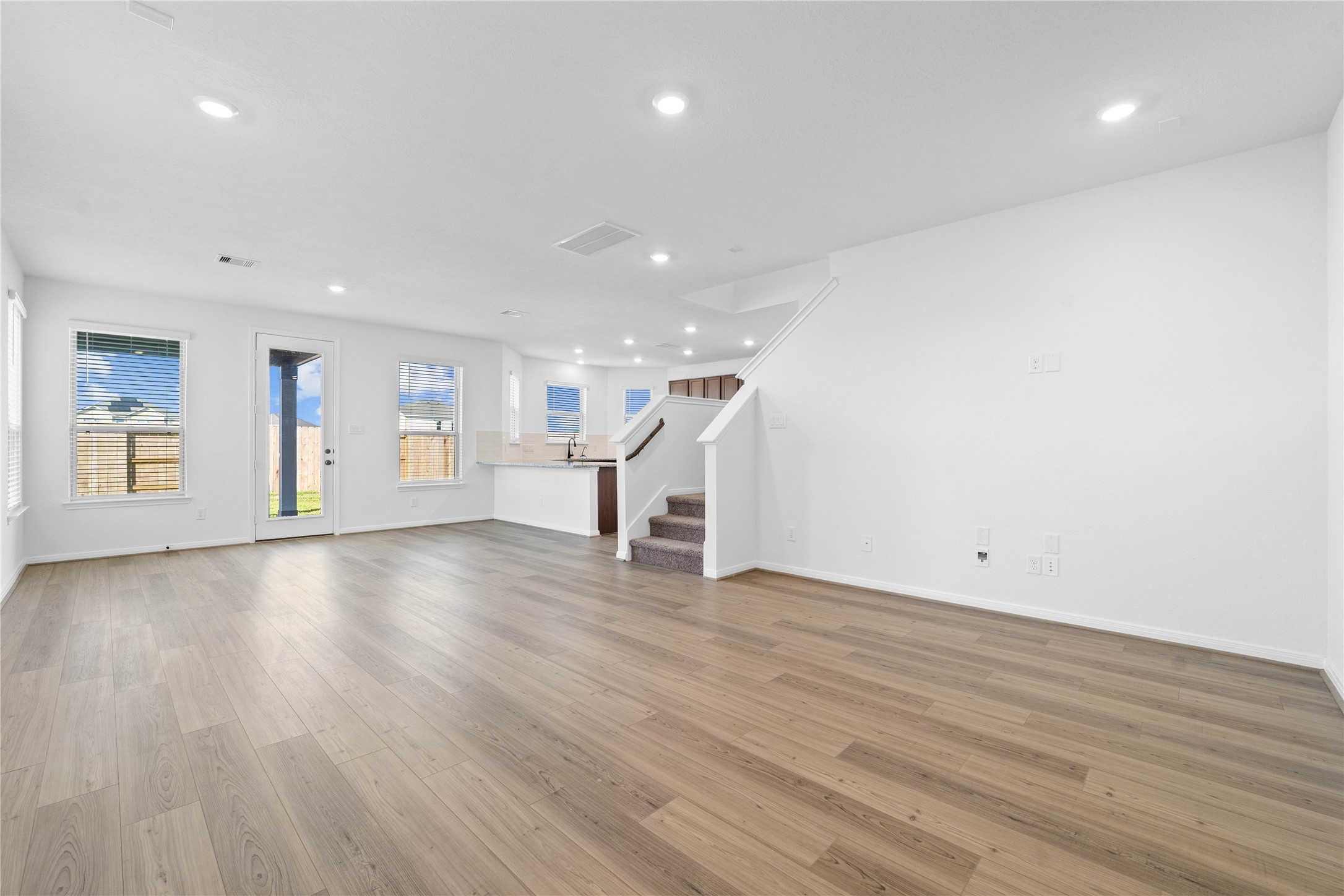 6410 Kentfield Drive Rosharon, TX 77583 - Photo 5 of 25 Beautiful open-concept layout effortlessly uniting the living, dining, and kitchen spaces—ideal for everyday comfort and entertaining guests!