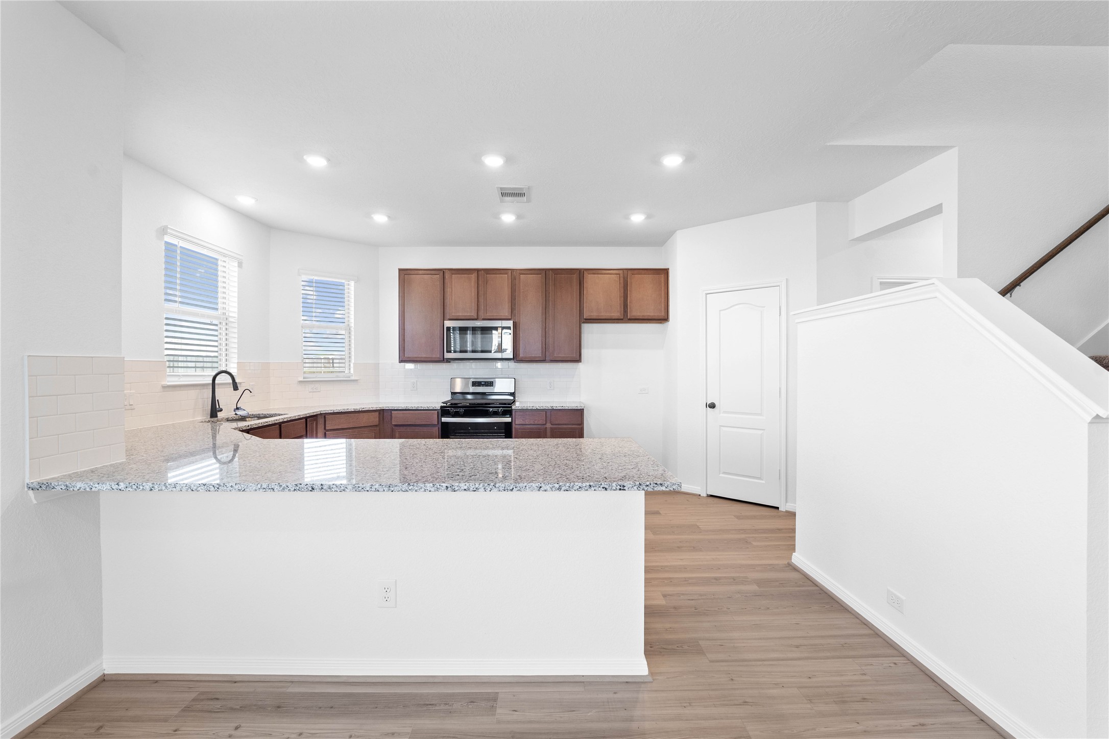 6410 Kentfield Drive Rosharon, TX 77583 - Photo 7 of 25 This spacious kitchen has it all—ample storage, generous counter space, and a layout that truly makes it the heart of the home.