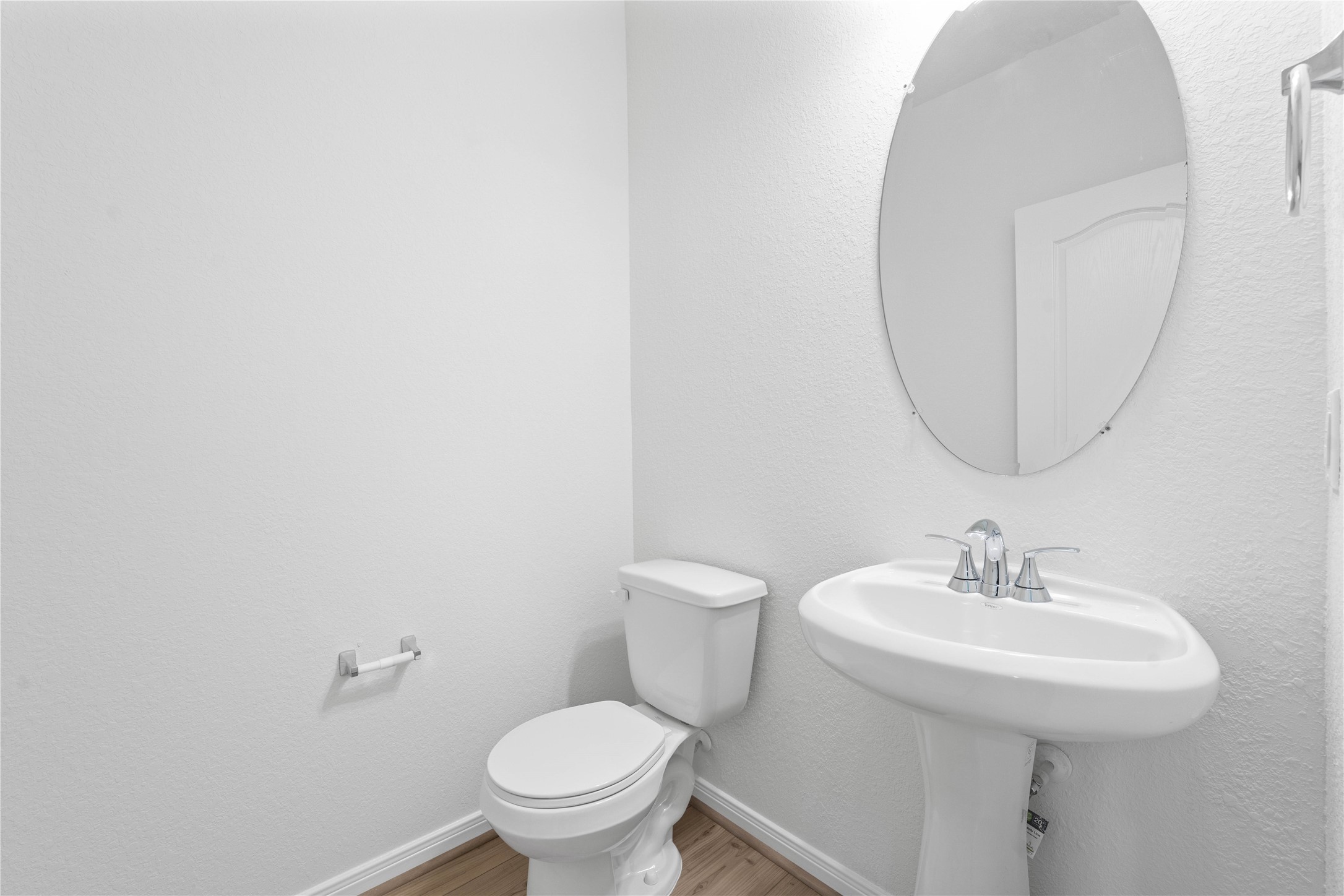6410 Kentfield Drive Rosharon, TX 77583 - Photo 9 of 25 The powder room on the first floor includes a pedestal sink, oval mirror, and toilet to conveniently meet your needs.