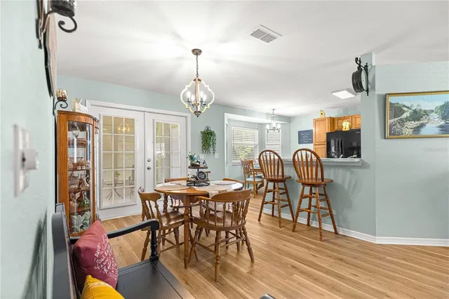 a dining room with furniture and window