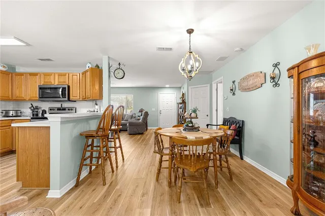 a bedroom with two beds and painting on the wall