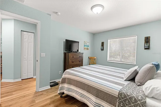 a bathroom with a granite countertop sink toilet a mirror a vanity and shower