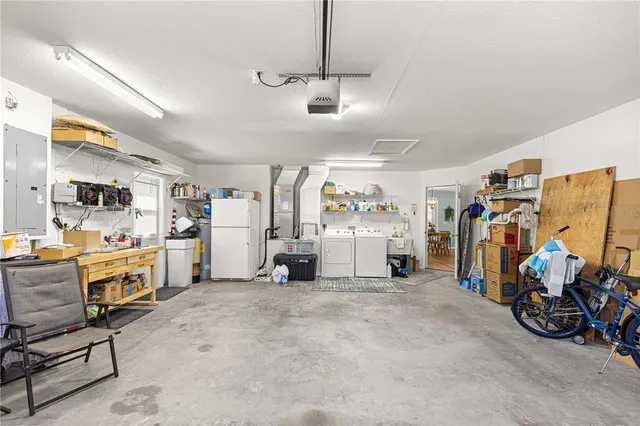 a view of a house with backyard and garden