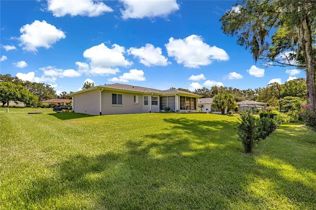 a view of a swimming pool with an outdoor space and seating area