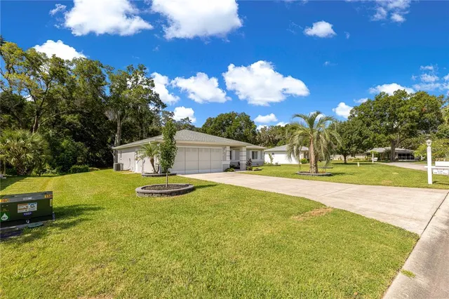 a front view of a house with swimming pool having outdoor seating