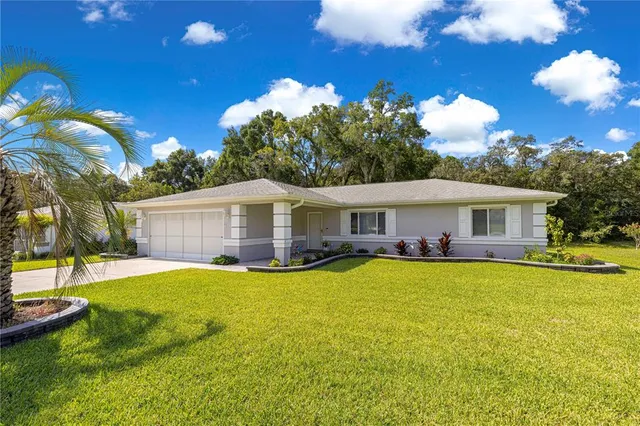 an aerial view of a house with a garden