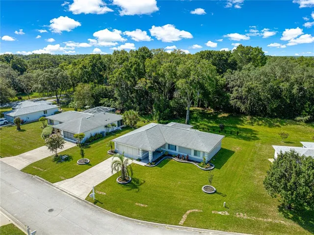 a view of a balcony with two chairs and a table
