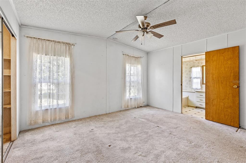 3026 Myakka River Road Tavares, FL 32778 - Photo 13 of 49 a view of an empty room with a window