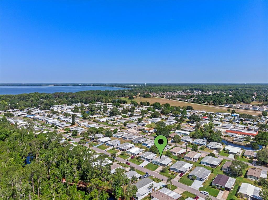 3026 Myakka River Road Tavares, FL 32778 - Photo 30 of 49 an aerial view of residential houses with outdoor space and trees