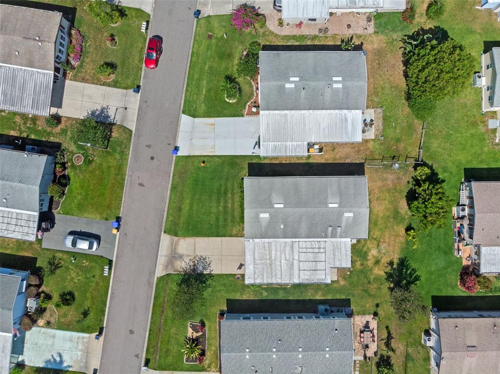 3026 Myakka River Road Tavares, FL 32778 - Photo 32 of 49 an aerial view of multiple houses with a yard