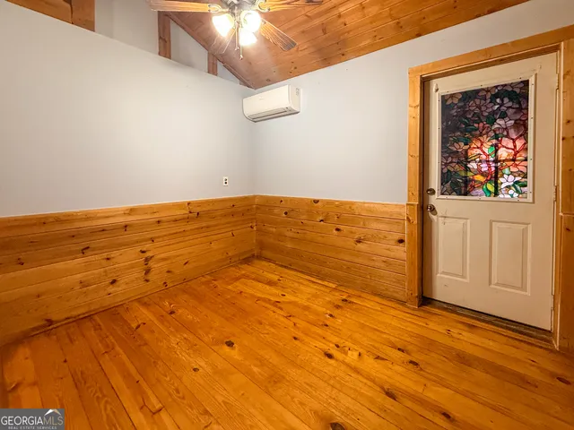 a spacious bathroom with a sink a mirror and a shower