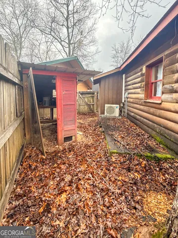 a balcony with wooden floor and fence