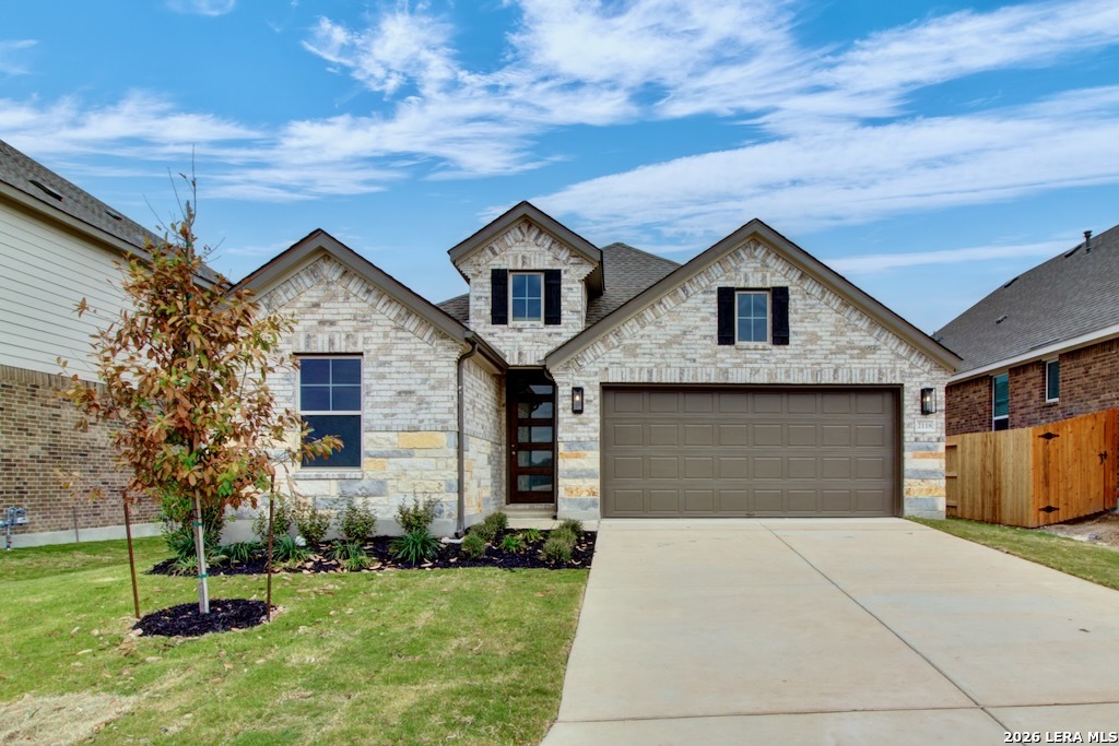 a front view of house with yard and green space