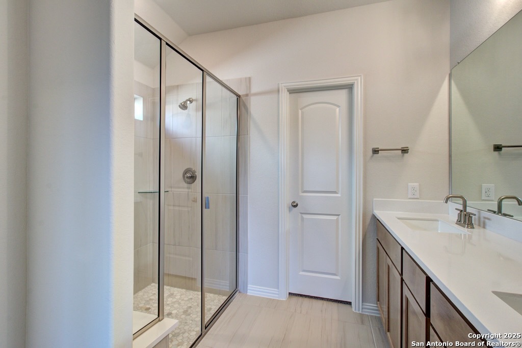 2118 Shepards Street Seguin, TX 78155 - Photo 21 of 22 a bathroom with a double vanity sink and mirror