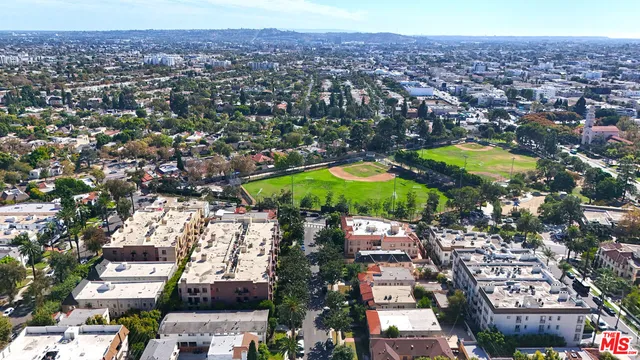 an aerial view of residential houses and city view