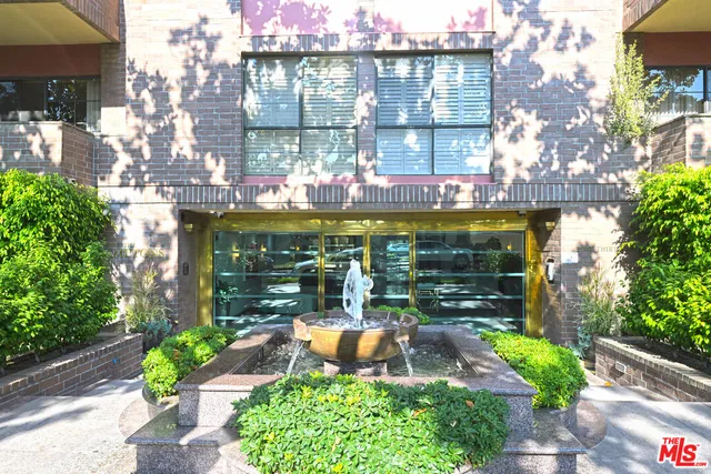 a view of a building with potted plants