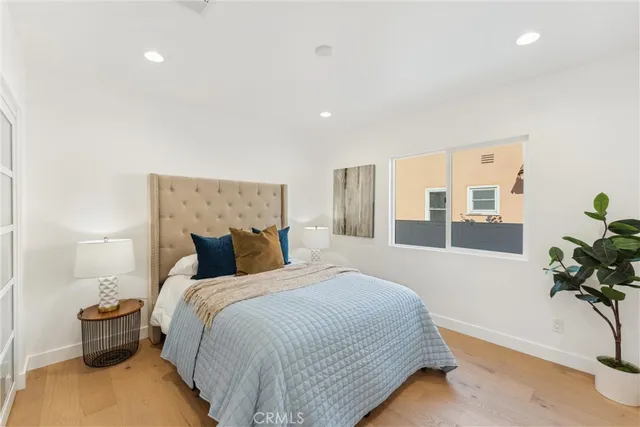 a bed room with a bed and a view of bedroom