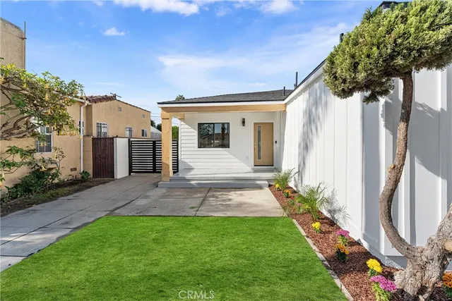 a view of a patio with a table and chairs