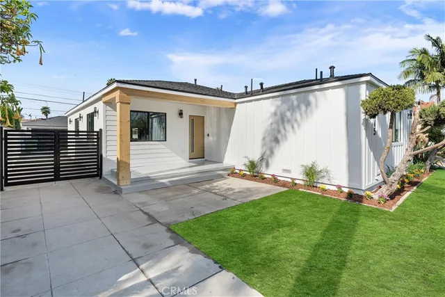 a view of a house with patio and wooden floor