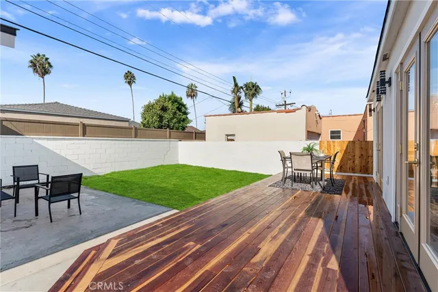 a view of a house with backyard porch and sitting area